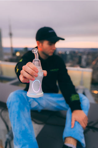 man using Dr. Dabber Boost EVO on the roof