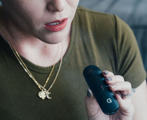 woman using G Pen Dash Vaporizer